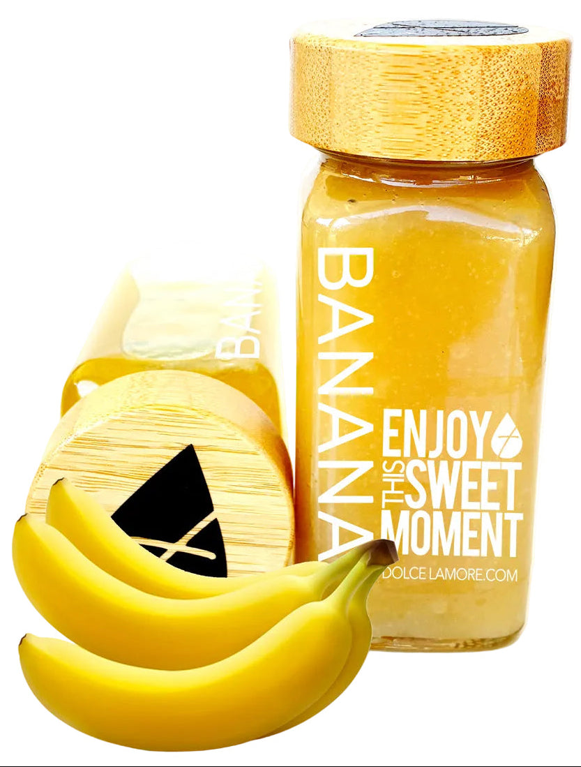 Glass bottle with wooden cap and banana design on a white background