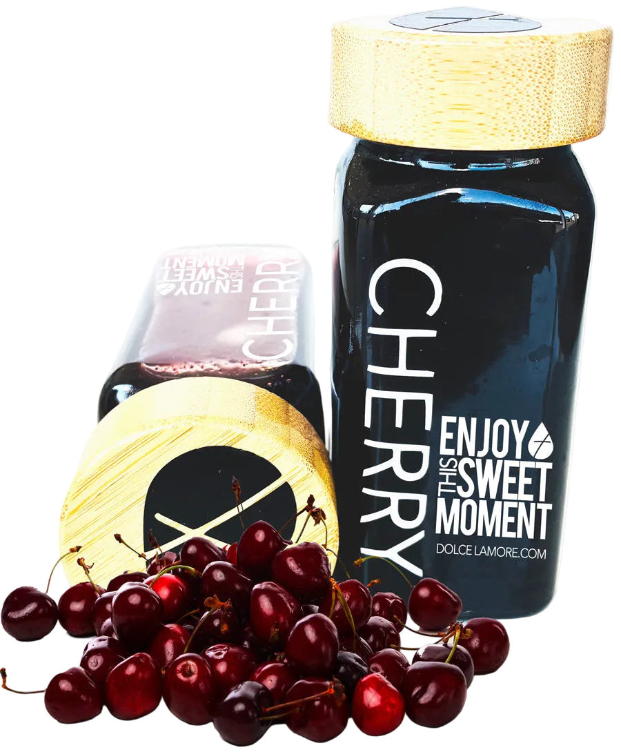 Bottle of Dolce L'Amore organic cherries puree with cherries on a white background
